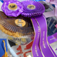 Purple Howard County Fair Best Of Show ribbon on plastic container of pie